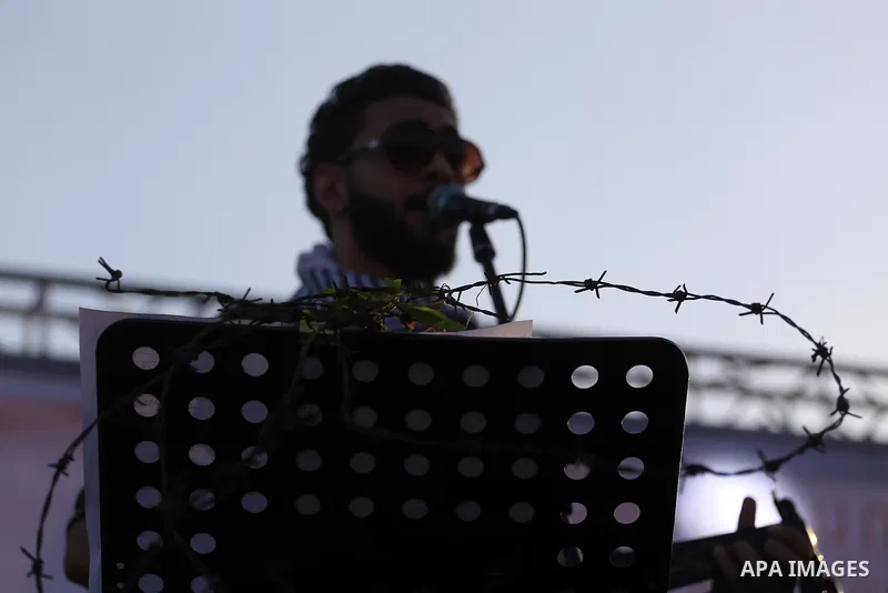 Musicians perform during a concert held in solidarity with Palestinian hunger-striking prisoners in Israeli jails, in Gaza City on May 4, 2017. Photo by Mohammed Asad