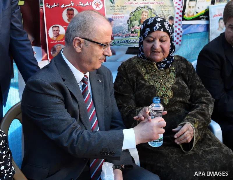 Palestinian Prime Minister Rami Hamdallah takes part at a protest tent in solidarity with Palestinian hunger-striking prisoners in Israeli jails, in the West Bank city of Ramallah on May 4, 2017. Photo by Prime Minister...