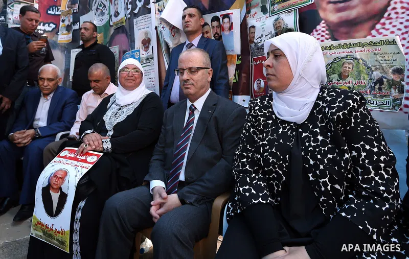 Palestinian Prime Minister Rami Hamdallah takes part at a protest tent in solidarity with Palestinian hunger-striking prisoners in Israeli jails, in the West Bank city of Ramallah on May 4, 2017. Photo by Prime Minister...