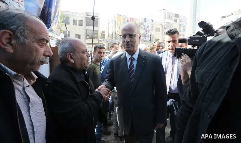 Palestinian Prime Minister Rami Hamdallah takes part at a protest tent in solidarity with Palestinian hunger-striking prisoners in Israeli jails, in the West Bank city of Ramallah on May 4, 2017. Photo by Prime Minister...