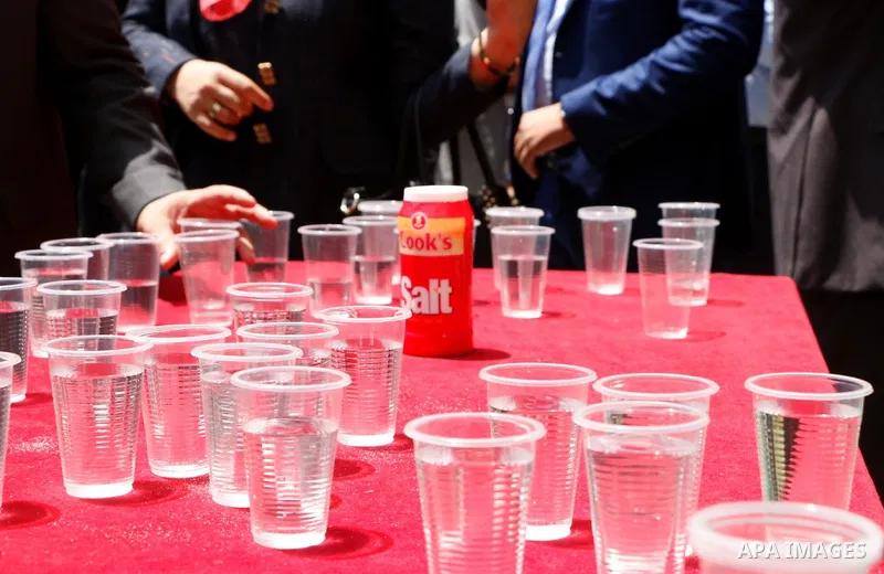 Arab League representatives drink water and salt during an event held in solidarity with Palestinian hunger-striking prisoners in Israeli jails, at the Arab League headquarters, in the Egyptian capital Cairo, on May 4, 2...