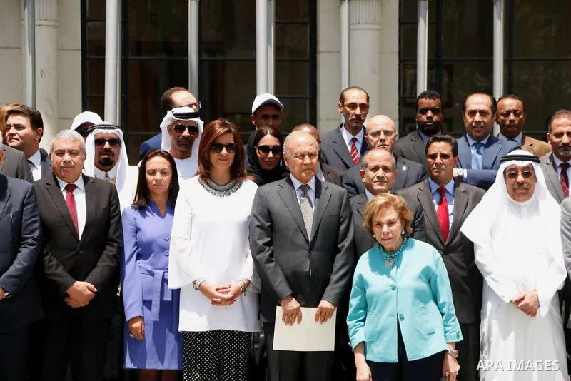 Arab League representatives and officials pose for a photo during an event held in solidarity with Palestinian hunger-striking prisoners in Israeli jails, at the Arab League headquarters, in the Egyptian capital Cairo, o...