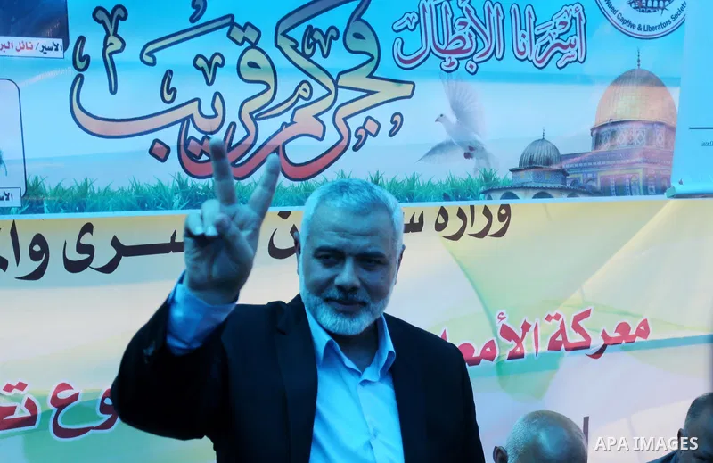 Newly elected Hamas chief, Ismail Haniya, gestures as he meets with protesters taking part in a sit-in in support of Palestinian hunger-striking prisoners held in Israeli jails, on May 8, 2017, in Gaza City. Photo by Ash...