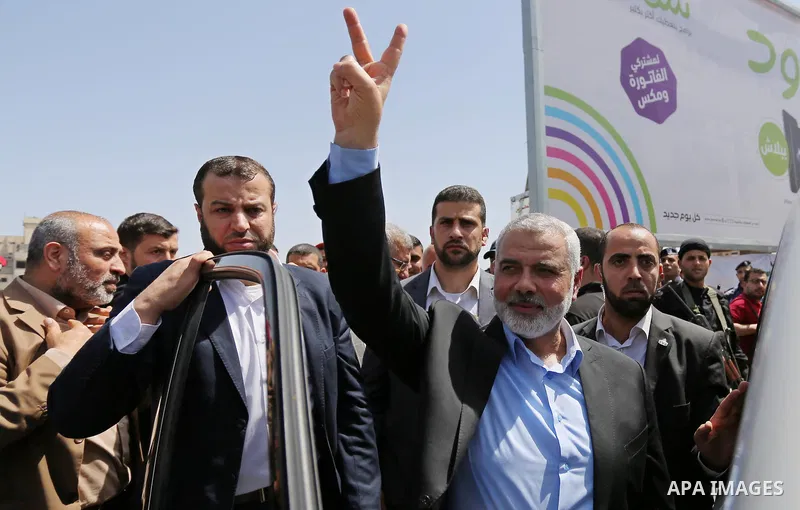 Newly elected Hamas chief, Ismail Haniya, flashes the V-sign after visiting protesters taking part in a sit-in in support of Palestinian hunger-striking prisoners held in Israeli jails, on May 8, 2017, in Gaza City. Phot...