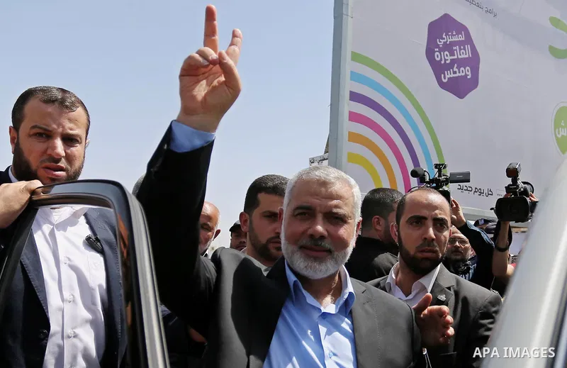 Newly elected Hamas chief, Ismail Haniya, flashes the V-sign after visiting protesters taking part in a sit-in in support of Palestinian hunger-striking prisoners held in Israeli jails, on May 8, 2017, in Gaza City. Phot...