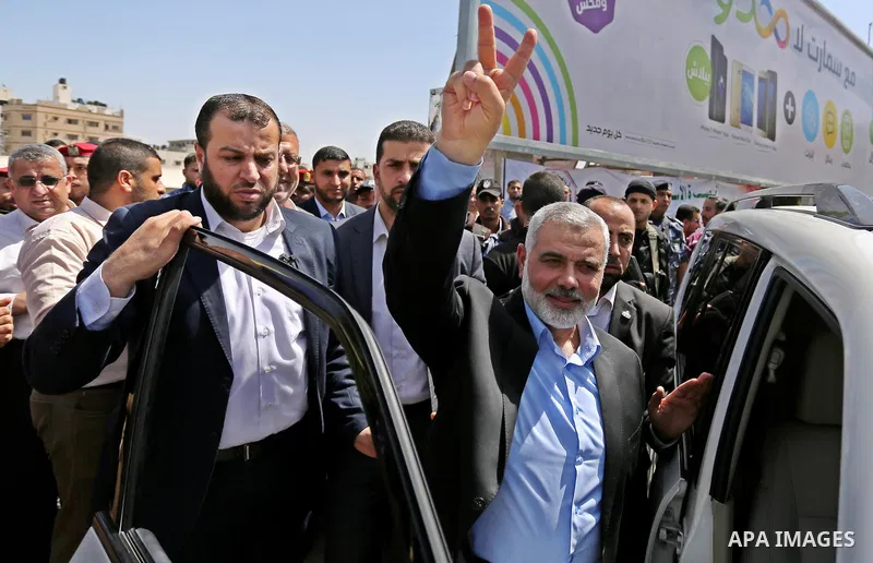 Newly elected Hamas chief, Ismail Haniya, flashes the V-sign after visiting protesters taking part in a sit-in in support of Palestinian hunger-striking prisoners held in Israeli jails, on May 8, 2017, in Gaza City. Phot...