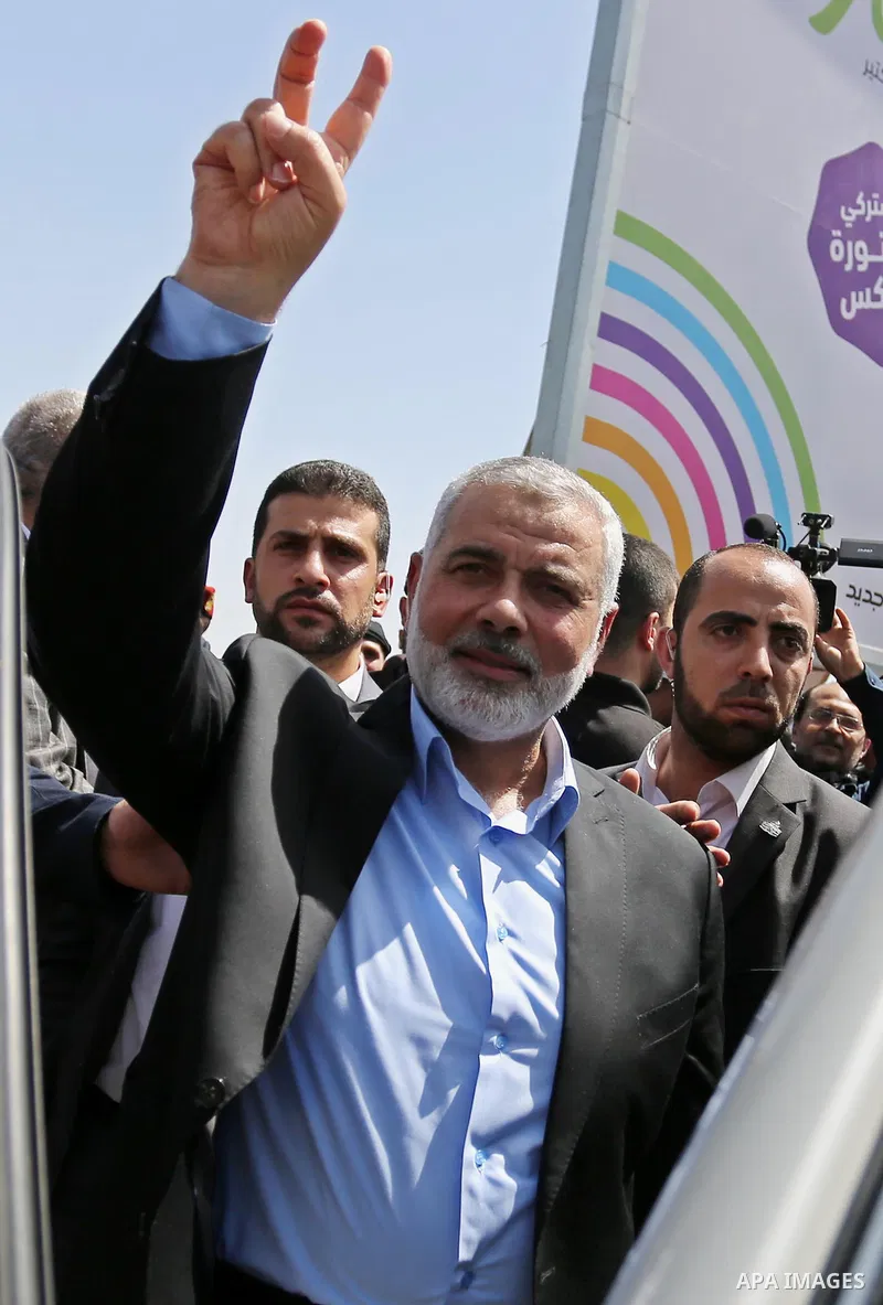 Newly elected Hamas chief, Ismail Haniya, flashes the V-sign after visiting protesters taking part in a sit-in in support of Palestinian hunger-striking prisoners held in Israeli jails, on May 8, 2017, in Gaza City. Phot...