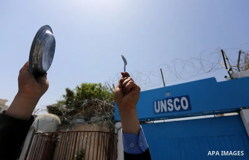 Palestinians hold banners during a sit-in in support of Palestinian hunger-striking prisoners held in Israeli jails in front of the headquarter United Nation "UNSCO", on May 9, 2017, in Gaza City. Photo by Mohammed Asad
