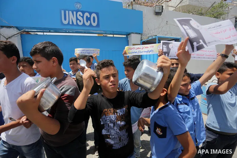 Palestinian children hold banners during a sit-in in support of Palestinian hunger-striking prisoners held in Israeli jails in front of the headquarter United Nation "UNSCO", on May 9, 2017, in Gaza City. Photo by Mohamm...