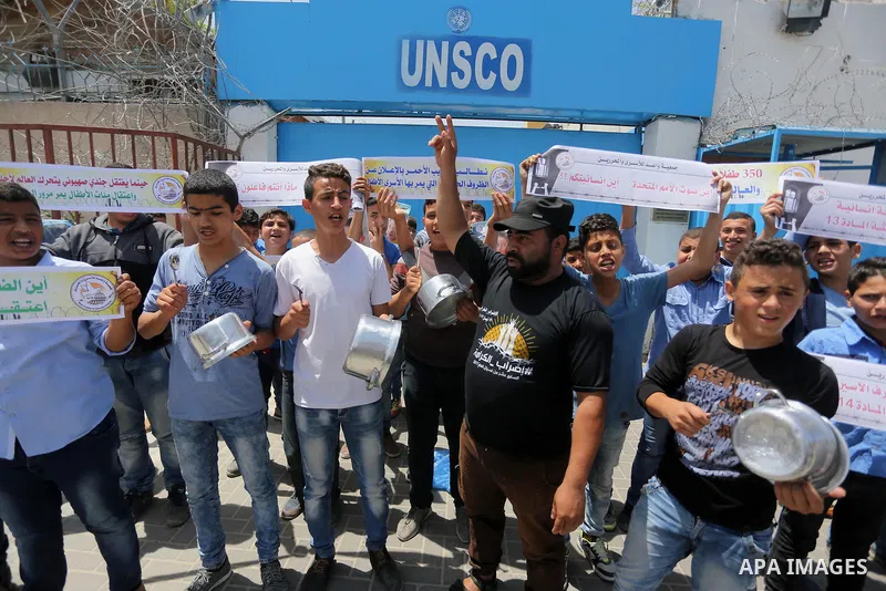 Palestinian children hold banners during a sit-in in support of Palestinian hunger-striking prisoners held in Israeli jails in front of the headquarter United Nation "UNSCO", on May 9, 2017, in Gaza City. Photo by Mohamm...
