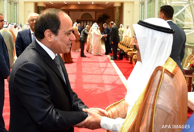 Egyptian President Abdel Fattah al-Sisi shakes hands with Emir of Kuwait Sheikh Sabah al-Ahmad al-Jaber al-Sabah before leaving Kuwait on May 09, 2017. Photo by Egyptian President Office