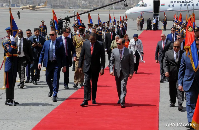 Egyptian President Abdel Fattah al-Sisi welcomes Kenyan President Uhuru Kenyatta upon his arrival at Cairo's international airport in Cairo, Egypt, on May 10, 2017. Photo by Egyptian President Office