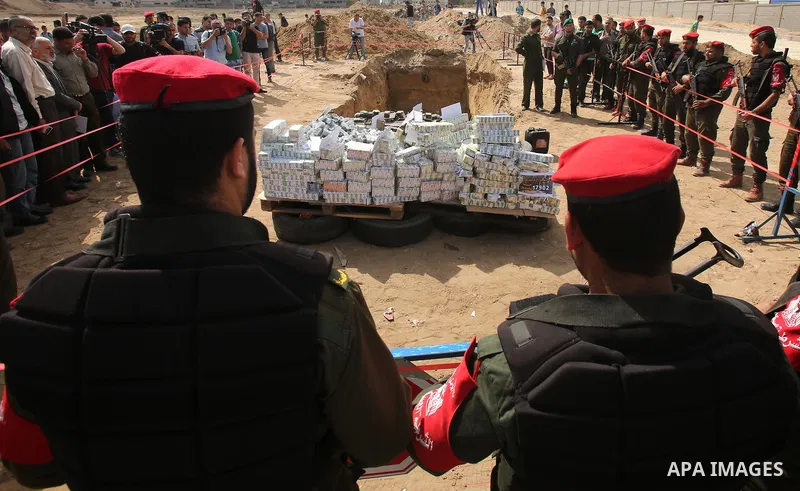 Members of Palestinian anti-drug police burn drugs that were seized by forces, in Gaza City May 11, 2017. Photo by Ashraf Amra