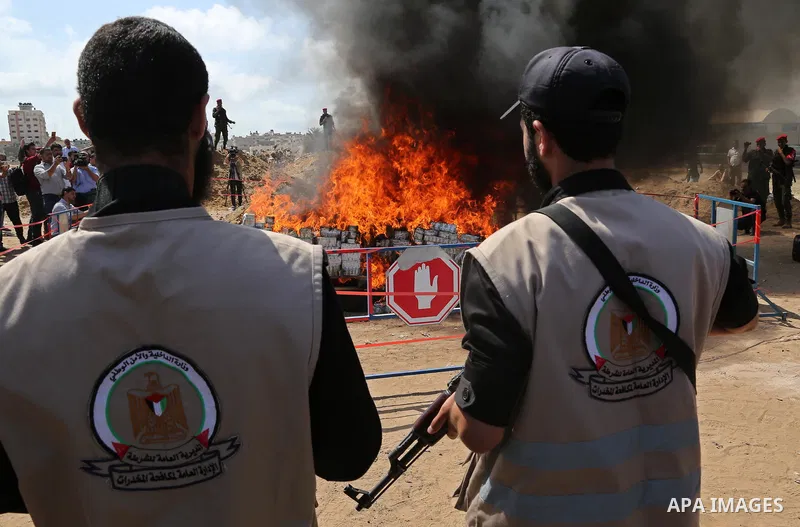 Members of Palestinian anti-drug police burn drugs that were seized by forces, in Gaza City May 11, 2017. Photo by Ashraf Amra