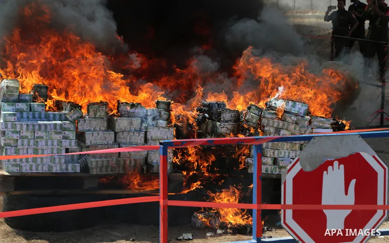 Members of Palestinian anti-drug police burn drugs that were seized by forces, in Gaza City May 11, 2017. Photo by Ashraf Amra