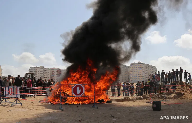 Members of Palestinian anti-drug police burn drugs that were seized by forces, in Gaza City May 11, 2017. Photo by Ashraf Amra