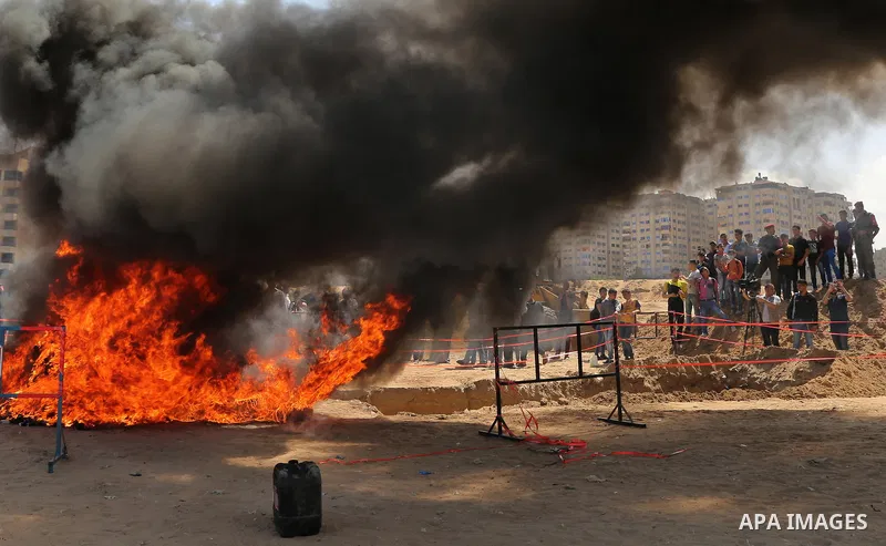 Members of Palestinian anti-drug police burn drugs that were seized by forces, in Gaza City May 11, 2017. Photo by Ashraf Amra