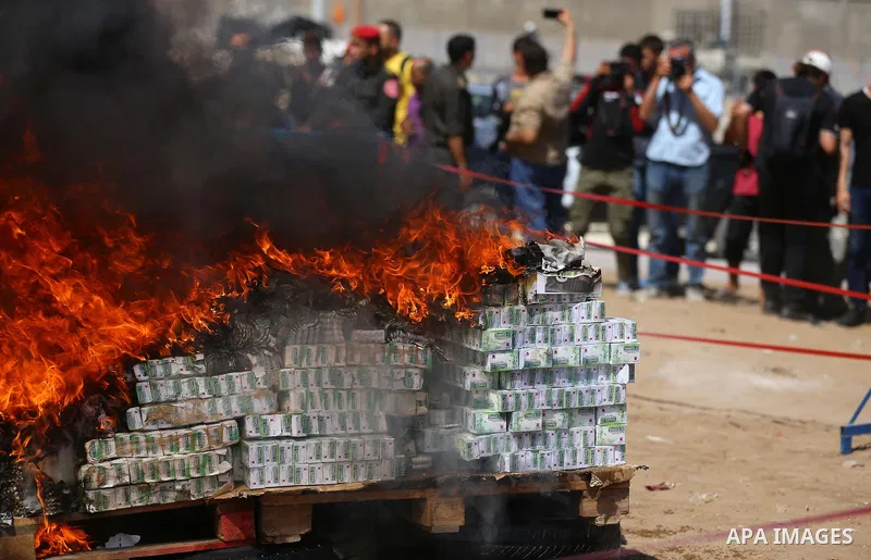 Members of Palestinian anti-drug police burn drugs that were seized by forces, in Gaza City May 11, 2017. Photo by Ashraf Amra