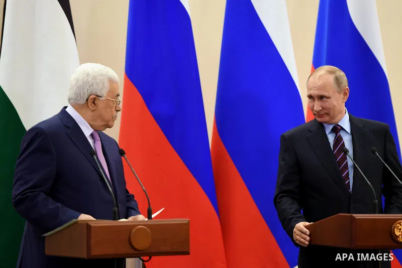 Russian President Vladimir Putin and Palestinian President Mahmoud Abbas attend a joint press conference following their meeting at the Bocharov Ruchei state residence in Sochi, Russia, May 11, 2017. Photo by Thaer Ganai...