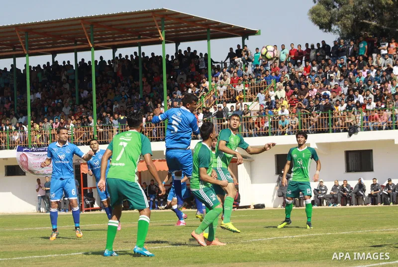 Palestinian Shabab Rafah football club players and Khadamat Rafah football club players compete during the final match of the Gaza Cup at Yarmouk stadium in Gaza City, on May 12, 2017. Photo by Ali Hamad