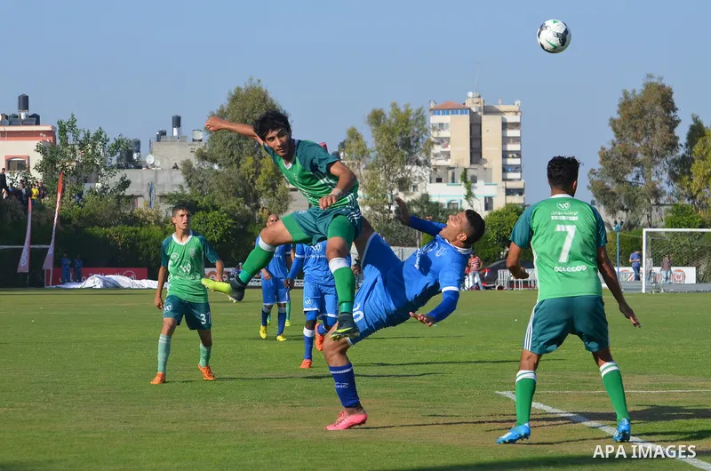 Palestinian Shabab Rafah football club players and Khadamat Rafah football club players compete during the final match of the Gaza Cup at Yarmouk stadium in Gaza City, on May 12, 2017. Photo by Mohammed El-Dalou