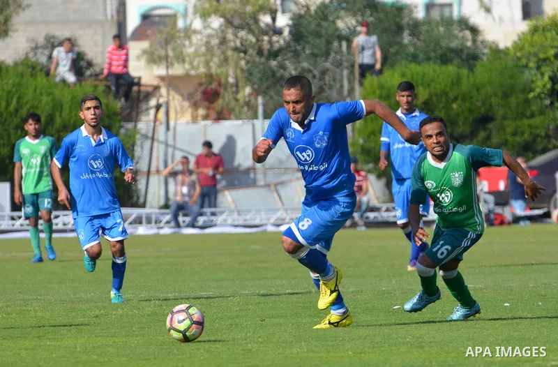 Palestinian Shabab Rafah football club players and Khadamat Rafah football club players compete during the final match of the Gaza Cup at Yarmouk stadium in Gaza City, on May 12, 2017. Photo by Mohammed El-Dalou