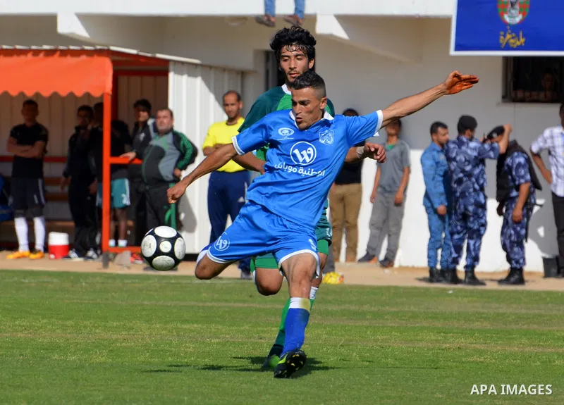 Palestinian Shabab Rafah football club players and Khadamat Rafah football club players compete during the final match of the Gaza Cup at Yarmouk stadium in Gaza City, on May 12, 2017. Photo by Mohammed El-Dalou