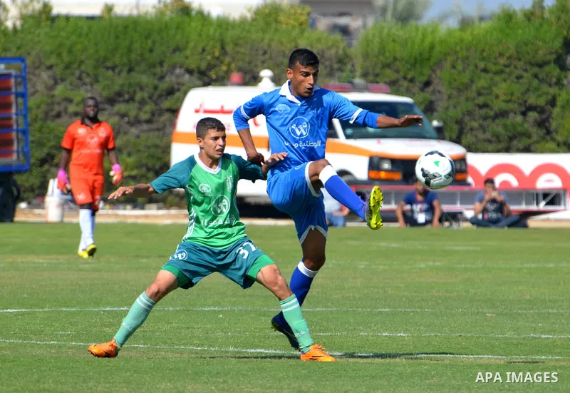Palestinian Shabab Rafah football club players and Khadamat Rafah football club players compete during the final match of the Gaza Cup at Yarmouk stadium in Gaza City, on May 12, 2017. Photo by Mohammed El-Dalou