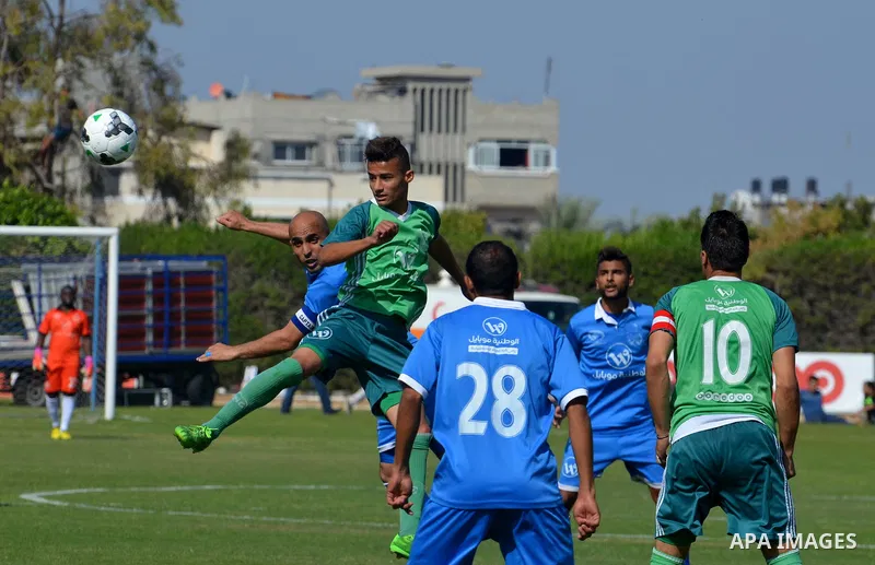 Palestinian Shabab Rafah football club players and Khadamat Rafah football club players compete during the final match of the Gaza Cup at Yarmouk stadium in Gaza City, on May 12, 2017. Photo by Mohammed El-Dalou
