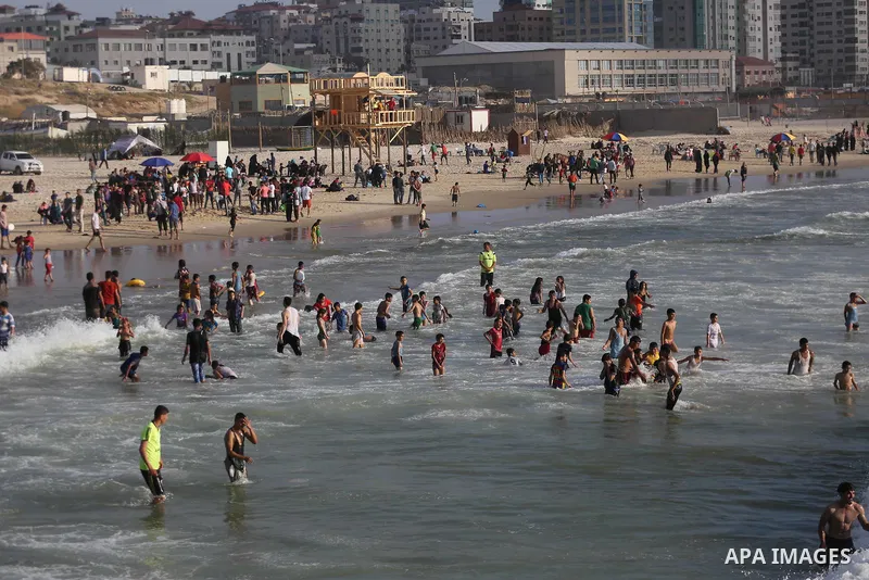 Palestinians enjoy their time off the beach of Gaza City on May 12, 2017. Photo by Mohammed Asad