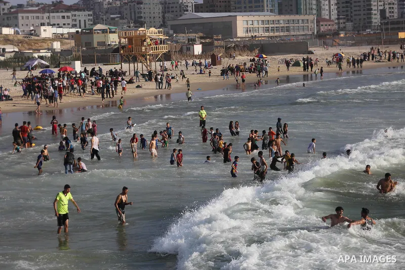 Palestinians enjoy their time off the beach of Gaza City on May 12, 2017. Photo by Mohammed Asad