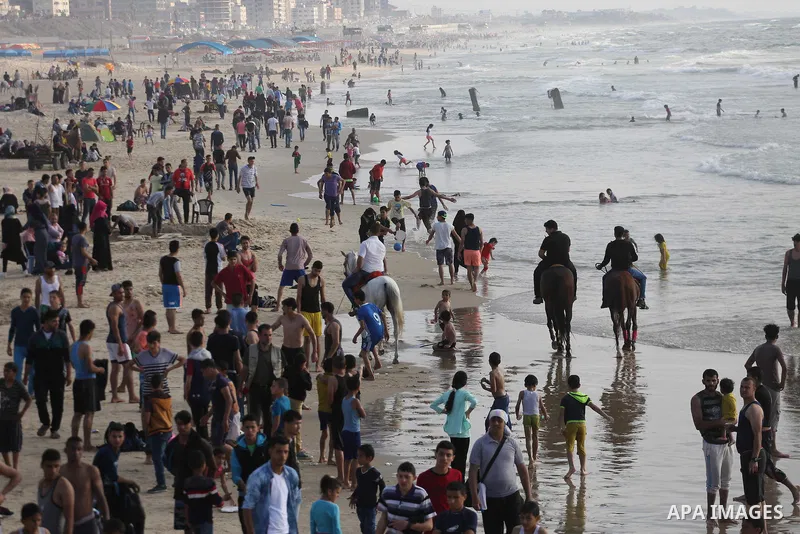 Palestinians enjoy their time off the beach of Gaza City on May 12, 2017. Photo by Mohammed Asad