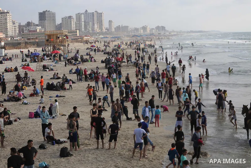Palestinians enjoy their time off the beach of Gaza City on May 12, 2017. Photo by Mohammed Asad