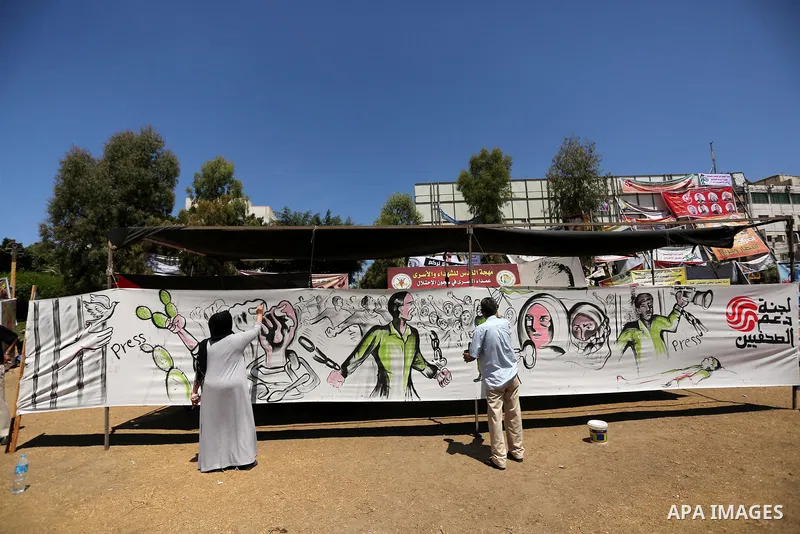 Palestinian artists paint a mural in solidarity with Palestinian prisoners on hunger strike in Israeli jails, and to commemorate the 68th anniversary of the "Nakba" or "catastrophe" in Arabic in reference to the establis...