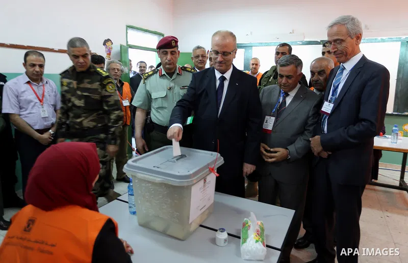 Palestinian Prime Minister Rami Hamdallah casts his ballot at a polling station during municipal elections in the northern West Bank town of Anabta, near Tulkarm May 13, 2017. Photo by Prime Minister Office