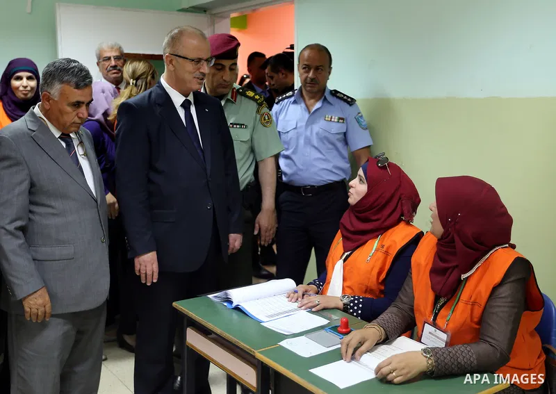 Palestinian Prime Minister Rami Hamdallah arrives to cast his ballot at a polling station during municipal elections in the northern West Bank town of Anabta, near Tulkarm May 13, 2017. Photo by Prime Minister Office
