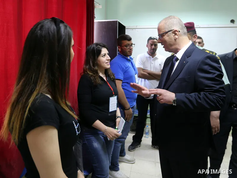 Palestinian Prime Minister Rami Hamdallah arrives to cast his ballot at a polling station during municipal elections in the northern West Bank town of Anabta, near Tulkarm May 13, 2017. Photo by Prime Minister Office