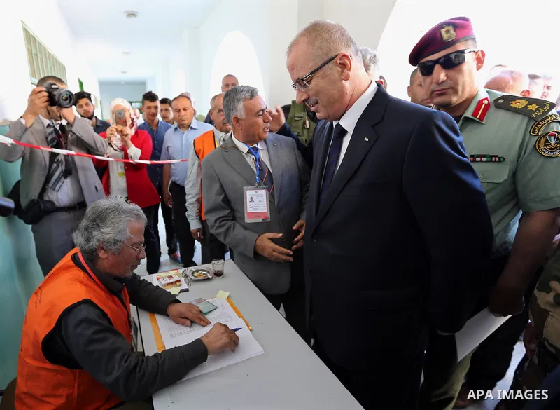 Palestinian Prime Minister Rami Hamdallah arrives to cast his ballot at a polling station during municipal elections in the northern West Bank town of Anabta, near Tulkarm May 13, 2017. Photo by Prime Minister Office