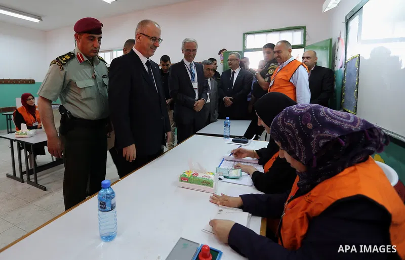 Palestinian Prime Minister Rami Hamdallah arrives to cast his ballot at a polling station during municipal elections in the northern West Bank town of Anabta, near Tulkarm May 13, 2017. Photo by Prime Minister Office