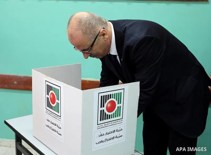 Palestinian Prime Minister Rami Hamdallah casts his ballot at a polling station during municipal elections in the northern West Bank town of Anabta, near Tulkarm May 13, 2017. Photo by Prime Minister Office