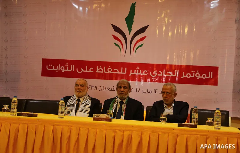 Senior Hamas leader Mahmoud al-Zahar, Deputy of the Legislative Council, Ahmed Bahar, and Palestinian leader of the Islamic Jihad Movement, Mohammed El-Hendi, attend a meeting, in Gaza city, on May 14, 2017. Photo by Ash...