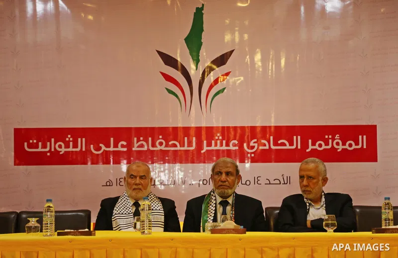 Senior Hamas leader Mahmoud al-Zahar, Deputy of the Legislative Council, Ahmed Bahar, and Palestinian leader of the Islamic Jihad Movement, Mohammed El-Hendi, attend a meeting, in Gaza city, on May 14, 2017. Photo by Ash...