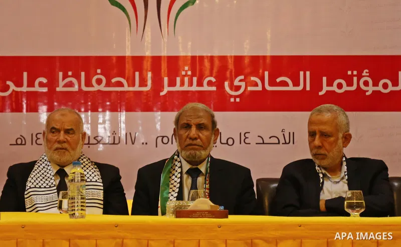 Senior Hamas leader Mahmoud al-Zahar, Deputy of the Legislative Council, Ahmed Bahar, and Palestinian leader of the Islamic Jihad Movement, Mohammed El-Hendi, attend a meeting, in Gaza city, on May 14, 2017. Photo by Ash...