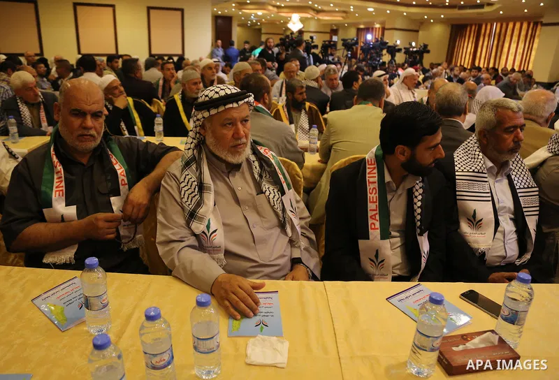 Palestinians attend a meeting organaized by Hamas and Islamic Jihad Movement, in Gaza city, on May 14, 2017. Photo by Ashraf Amra