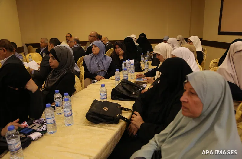 Palestinians attend a meeting organaized by Hamas and Islamic Jihad Movement, in Gaza city, on May 14, 2017. Photo by Ashraf Amra