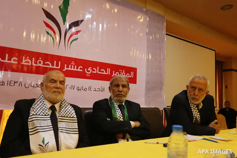 Senior Hamas leader Mahmoud al-Zahar, Deputy of the Legislative Council, Ahmed Bahar, and Palestinian leader of the Islamic Jihad Movement, Mohammed El-Hendi, attend a meeting, in Gaza city, on May 14, 2017. Photo by Ash...