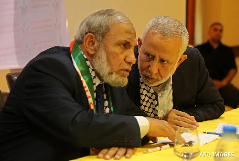 Senior Hamas leader Mahmoud al-Zahar and Palestinian leader of the Islamic Jihad Movement, Mohammed El-Hendi, attend a meeting, in Gaza city, on May 14, 2017. Photo by Ashraf Amra