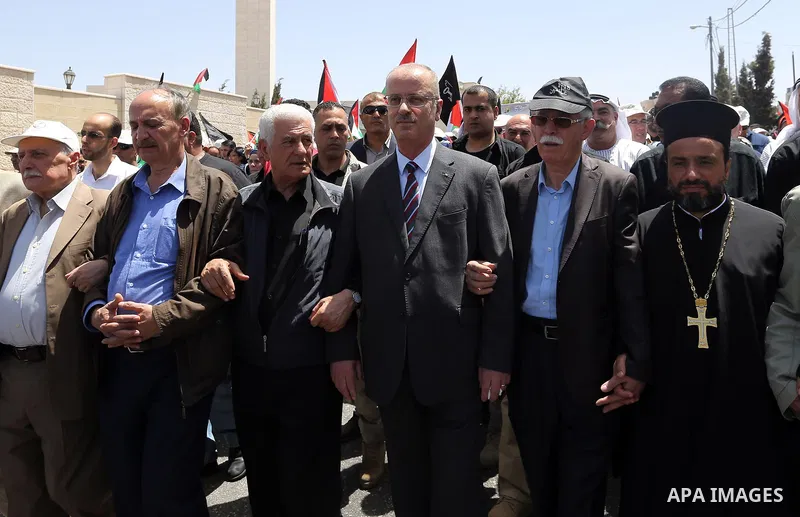 Palestinian Prime Minister Rami Hamdallah takes part in a rally to mark the 69th anniversary of the "Nakba" or "catastrophe" in Arabic in reference to the establishment in 1948 of the state of Israel, in the West Bank ci...
