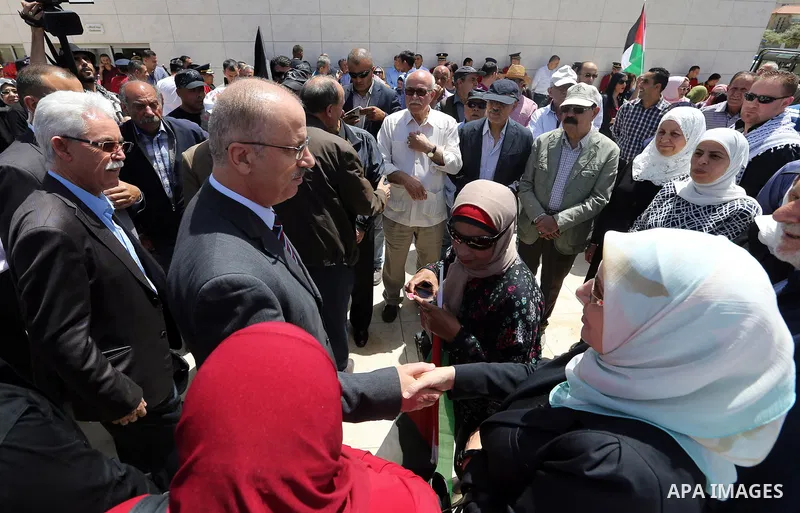 Palestinian Prime Minister Rami Hamdallah takes part in a rally to mark the 69th anniversary of the "Nakba" or "catastrophe" in Arabic in reference to the establishment in 1948 of the state of Israel, in the West Bank ci...