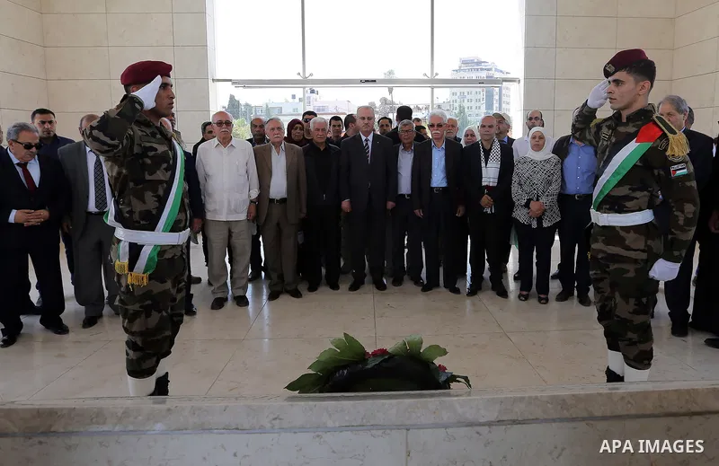 Palestinian Prime Minister Rami Hamdallah lays a wreath on the grave of late Palestinian leader Yasser Arafat, to mark the 69th anniversary of the "Nakba" or "catastrophe" in Arabic in reference to the establishment in 1...
